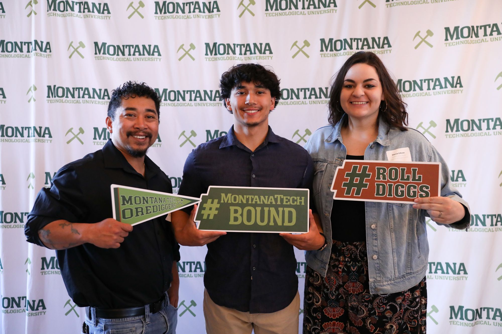 A student and family pose for a photo at the Scholars Reception