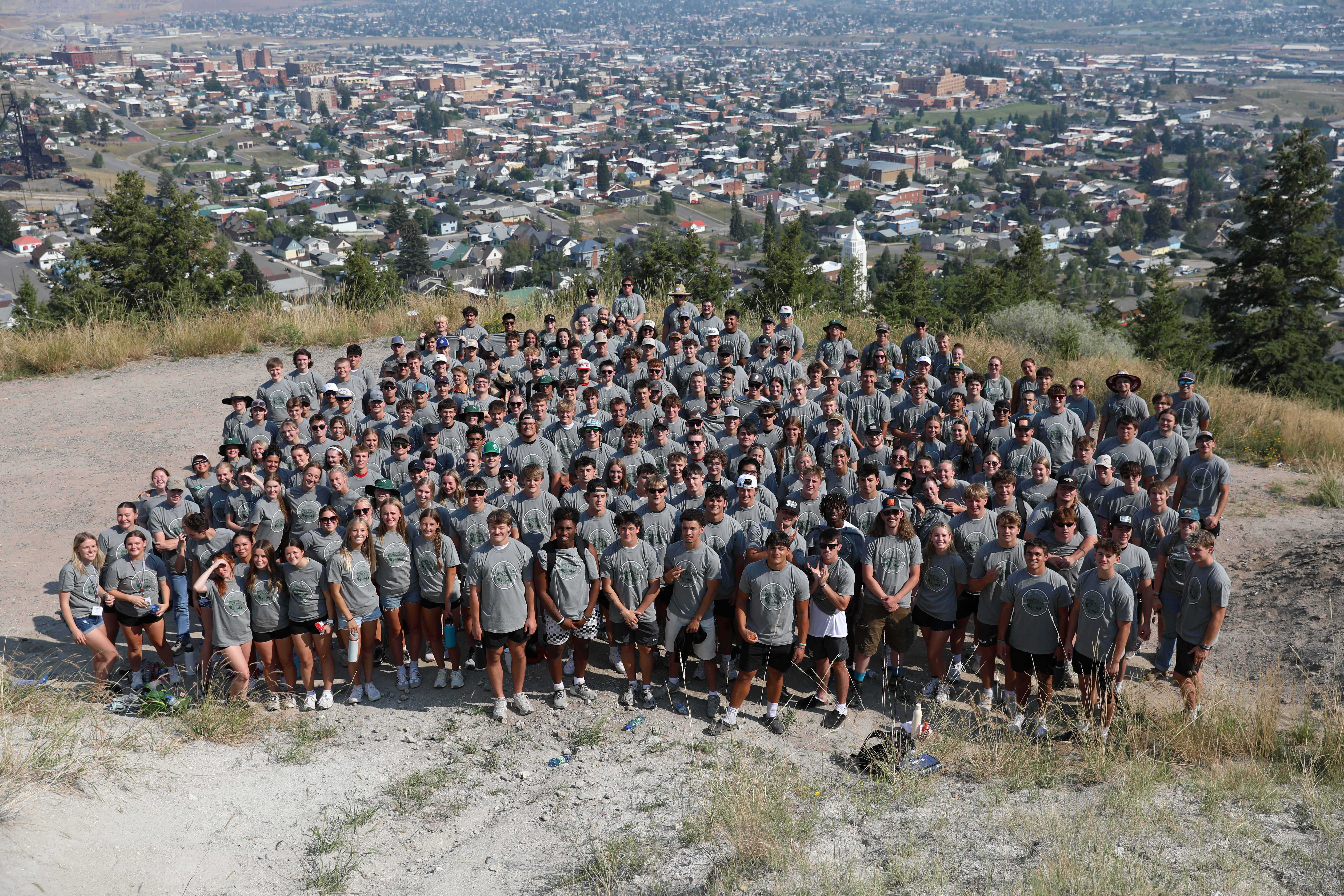 A group of students hike to the M.