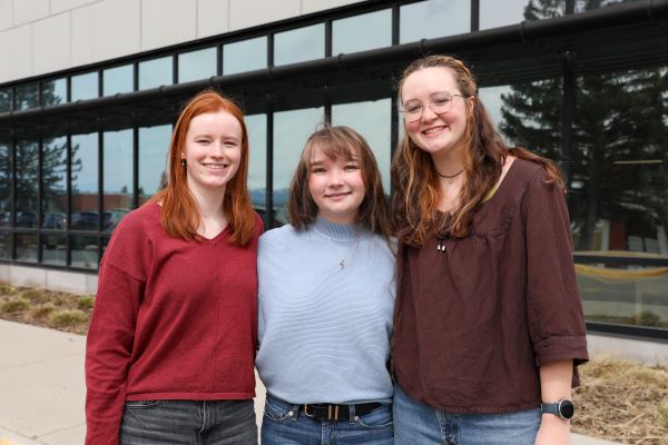 Three female Montana Tech students pose in a group for a photo