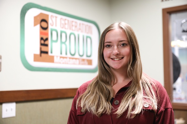 Paige in front of TRIO sign