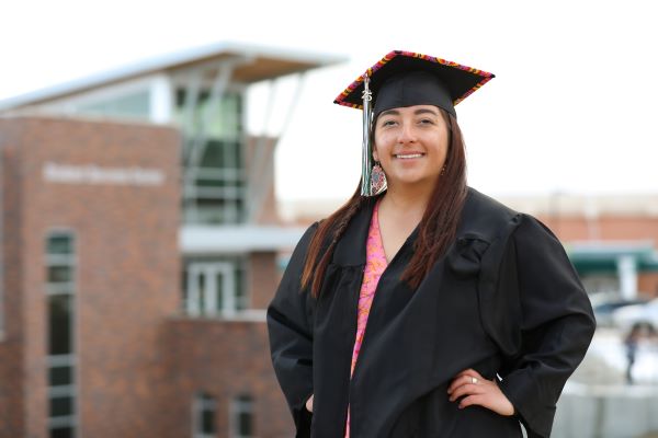 Rylee Mitchell in a beaded cap and gown