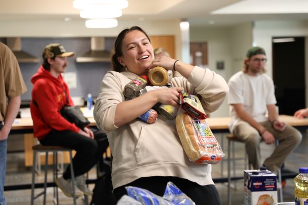 A student grabs ingredients in Copper Chef