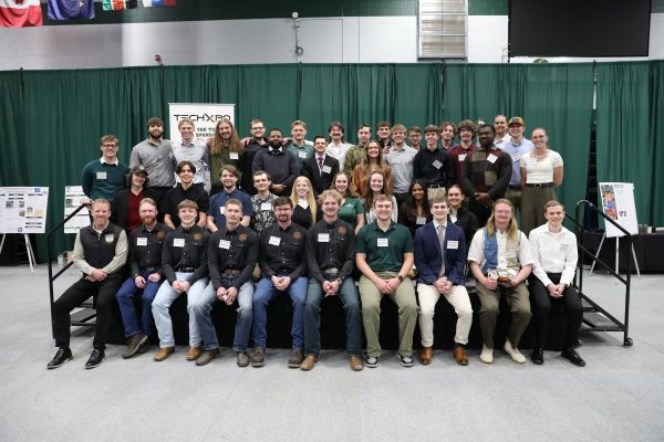 !A group of Techxpo winners poses for a photo with Chancellor Johnny MacLean