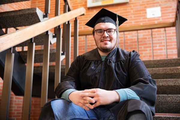 Cein in his cap and gown