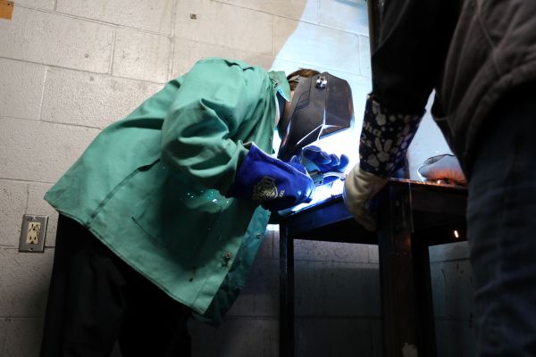 A student welds