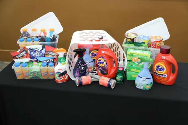 Prize basket with various food and laundry items