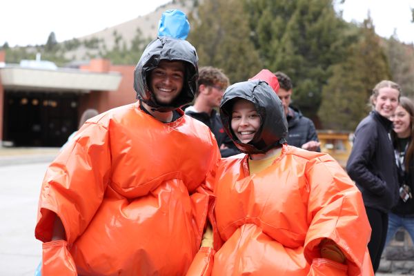 !Two students in oversized suits