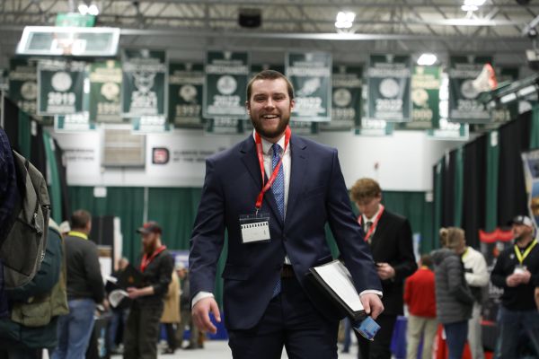 A student in a suit at Career Fair