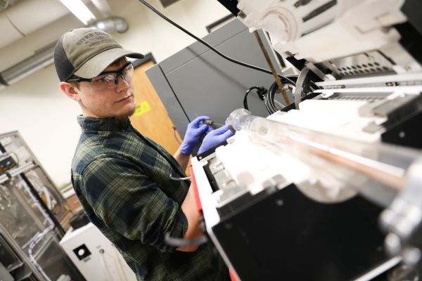 !Students work in a lab. 
