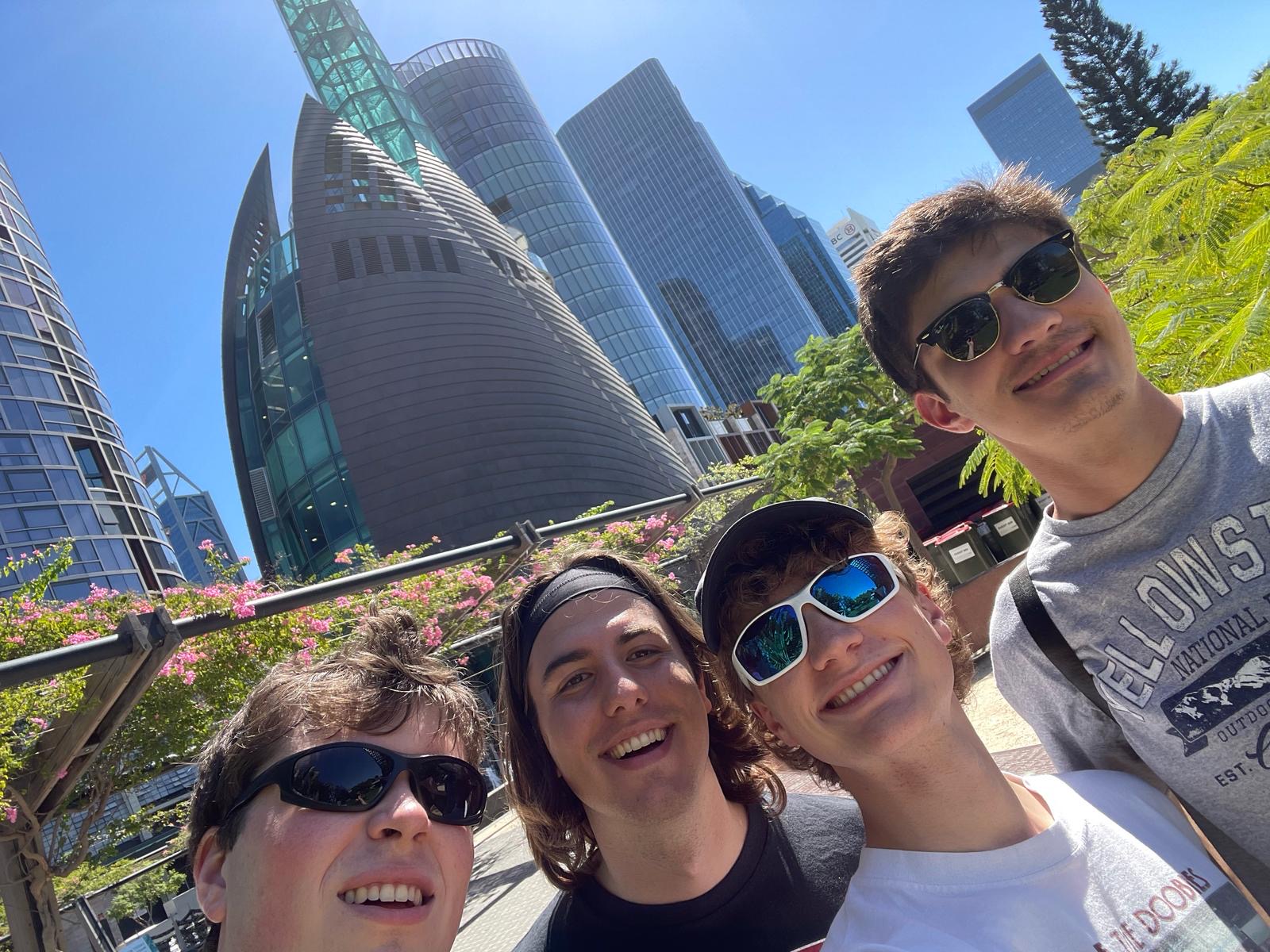 Four students pose for a photo in Australia.