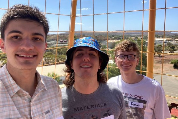 Three students pose for a photo in Australia