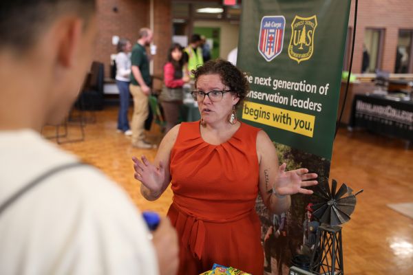 !A recruiter talks with students