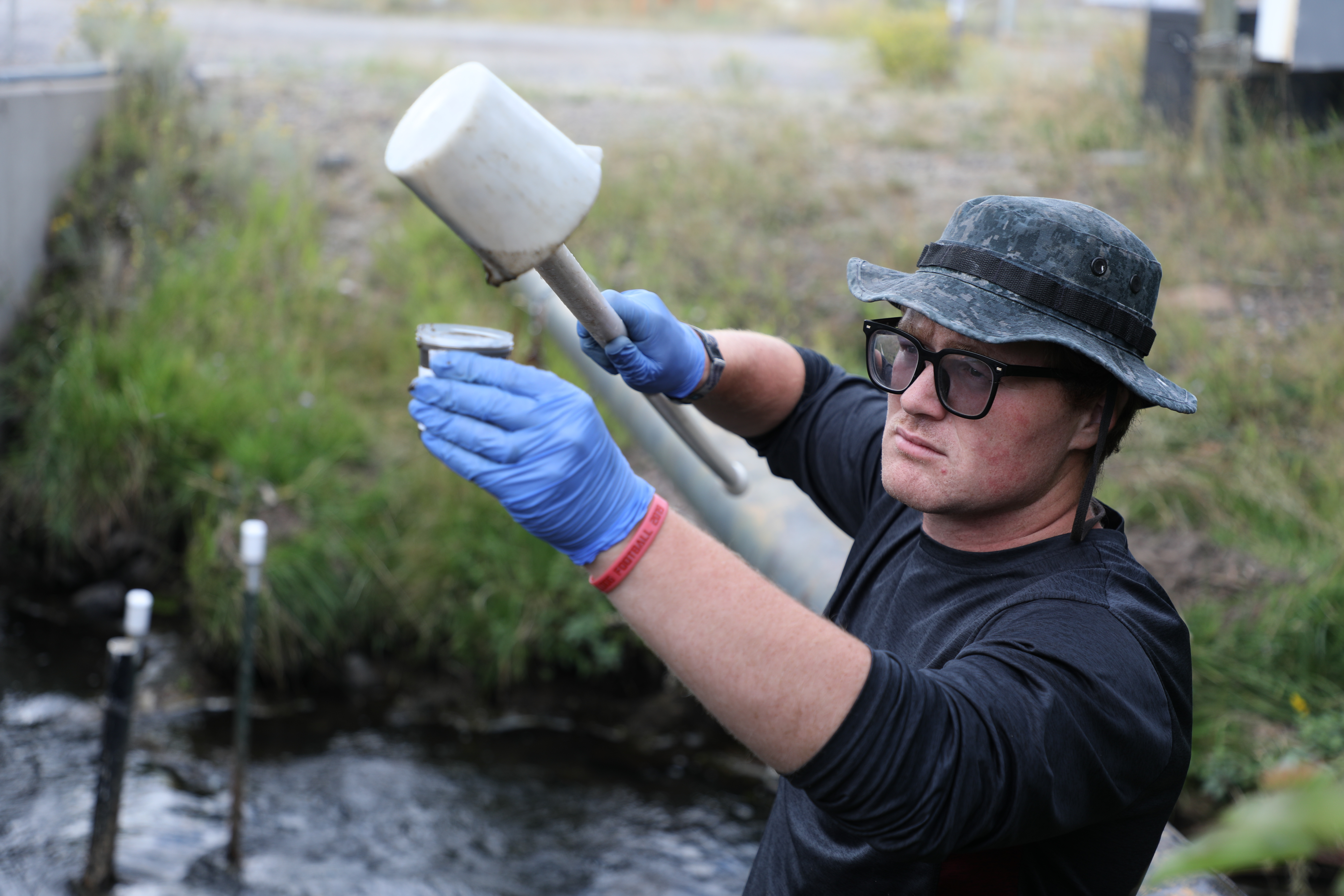 !Paul Helfrich works in the creek
