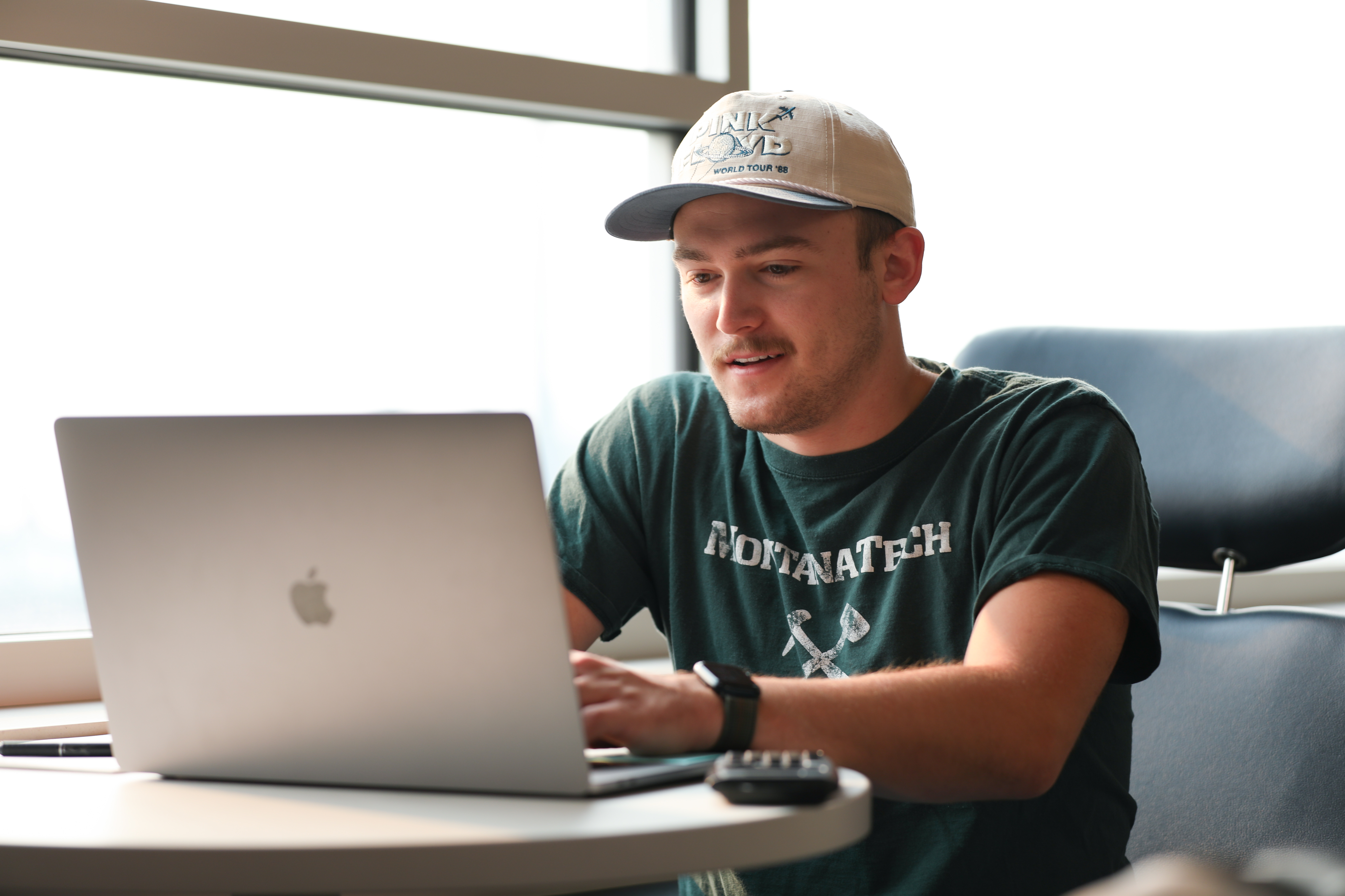 !Evan Guengerich  works on a laptop