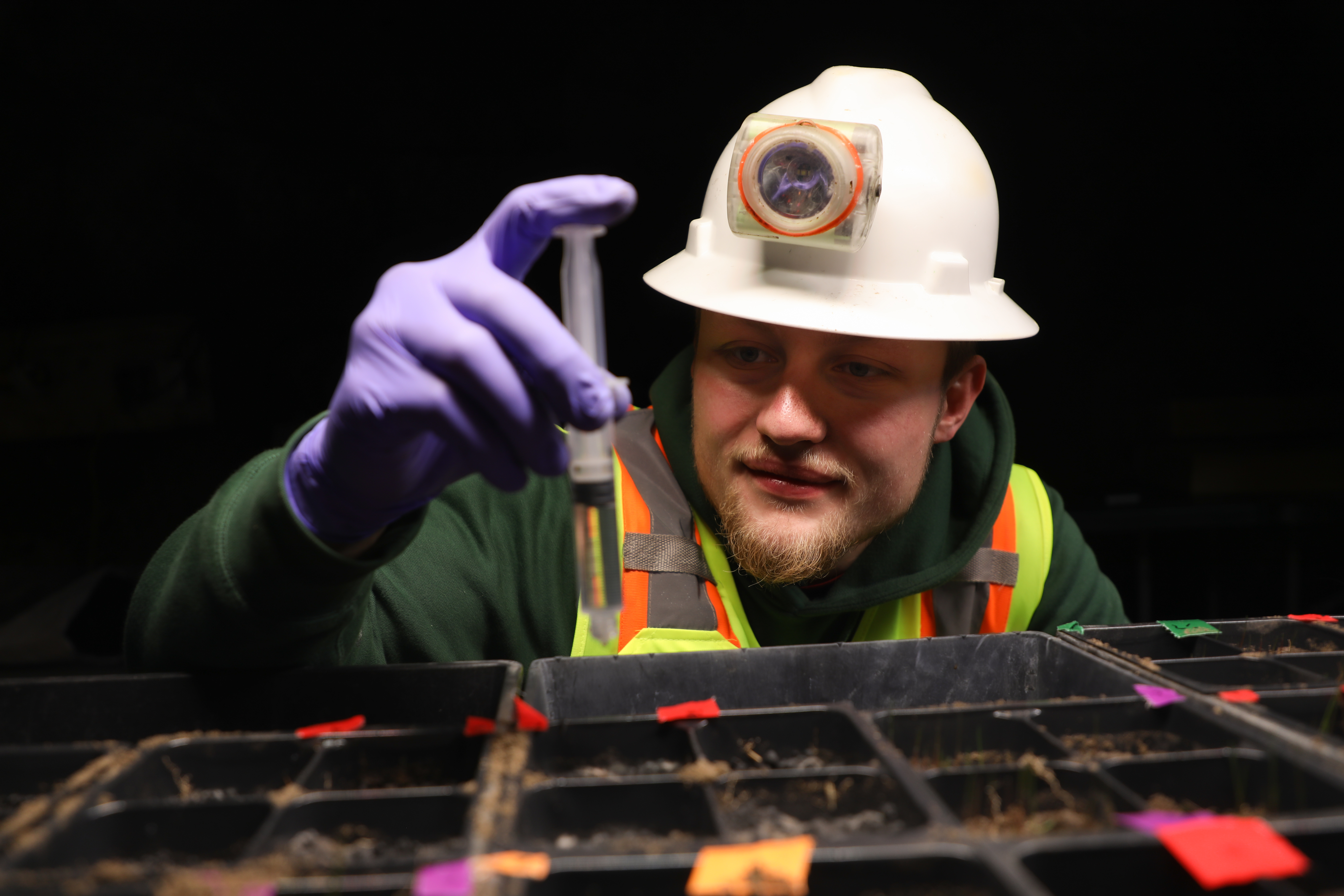!Gavin Rahl works in the Underground Greenhouse