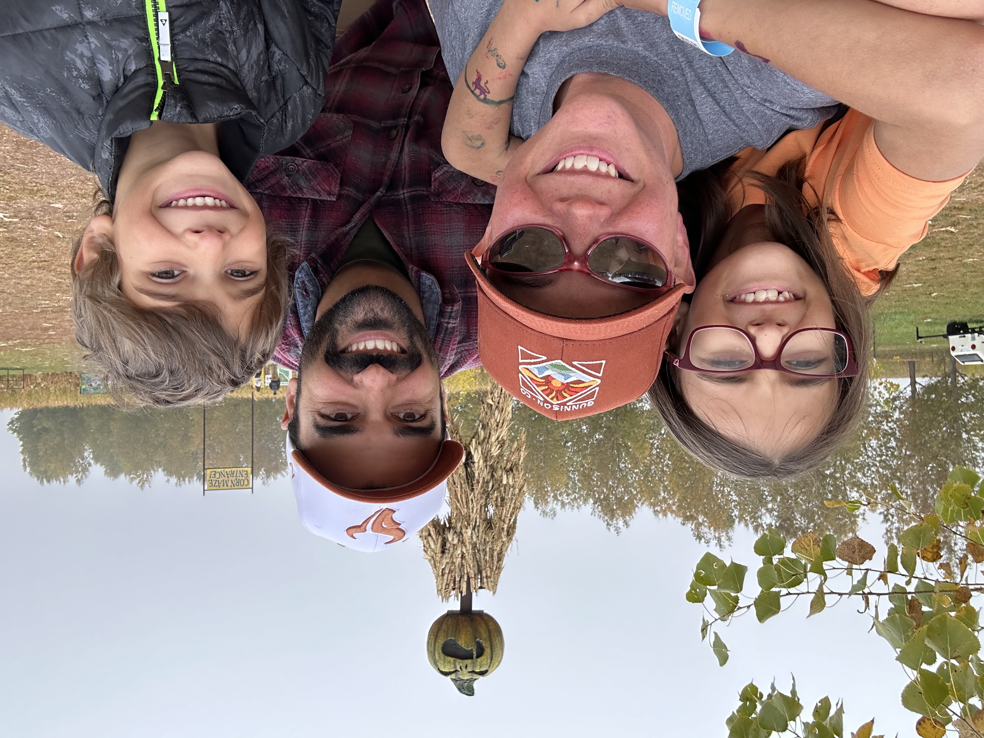 !Erin Dienes poses with her family 