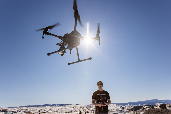 Student flying a drone