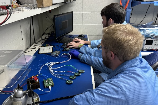 Students working with electrical equipment. 