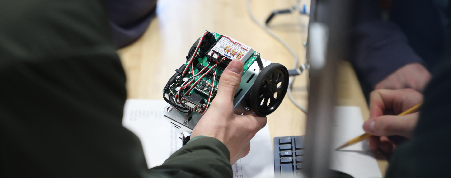 Hand holding a robotic car