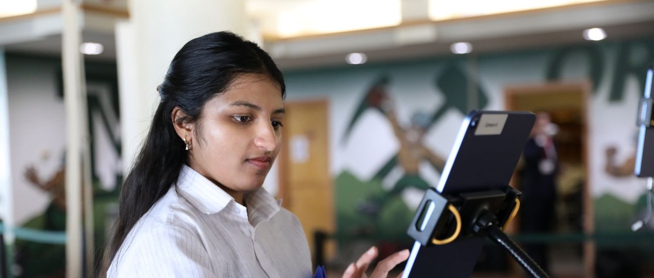 A woman checks in at Career Fair. 