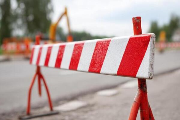 Red and white construction barrier