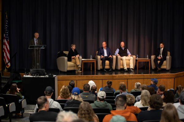 energy panelists seated on stage 