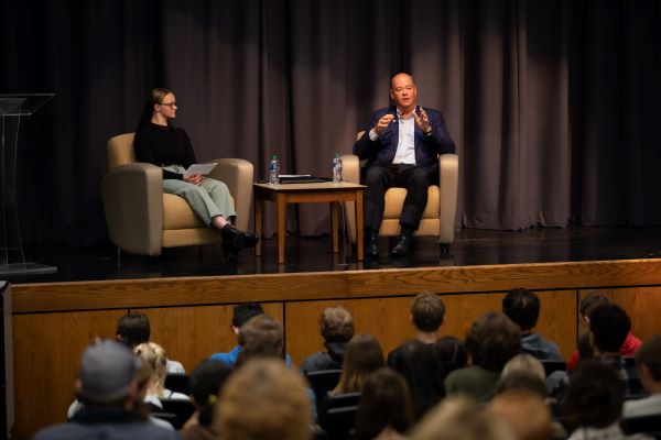 !Ryan Lance and Taylor Liva on stage in front of students 