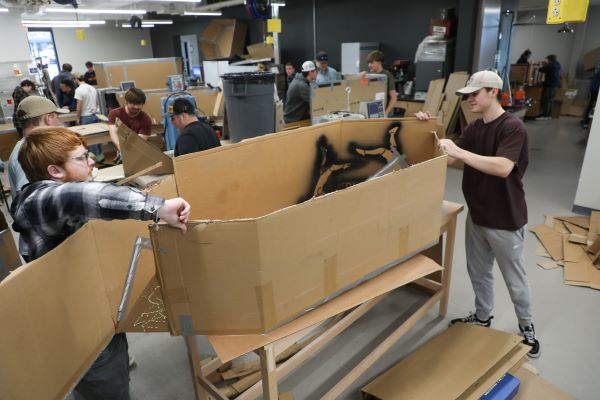 Students build a cardboard boat