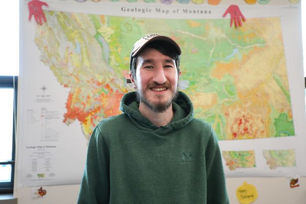 Daniel Buckley in front of a map. 