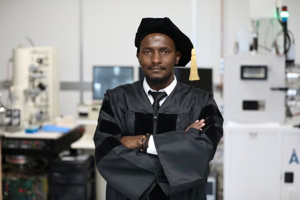 Amos Taiswa in cap and gown