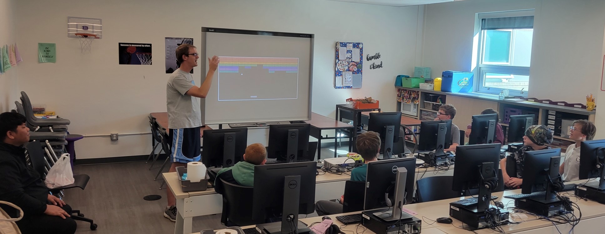 Joel Graff with students in computer lab. 