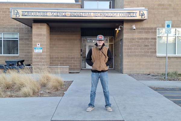 !Chase Brown in front of the Beaverhead High School Ag-Science-Industrial technology complex 