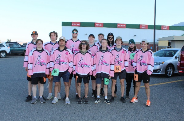 The Oredigger Hockey Team in pink jerseys.