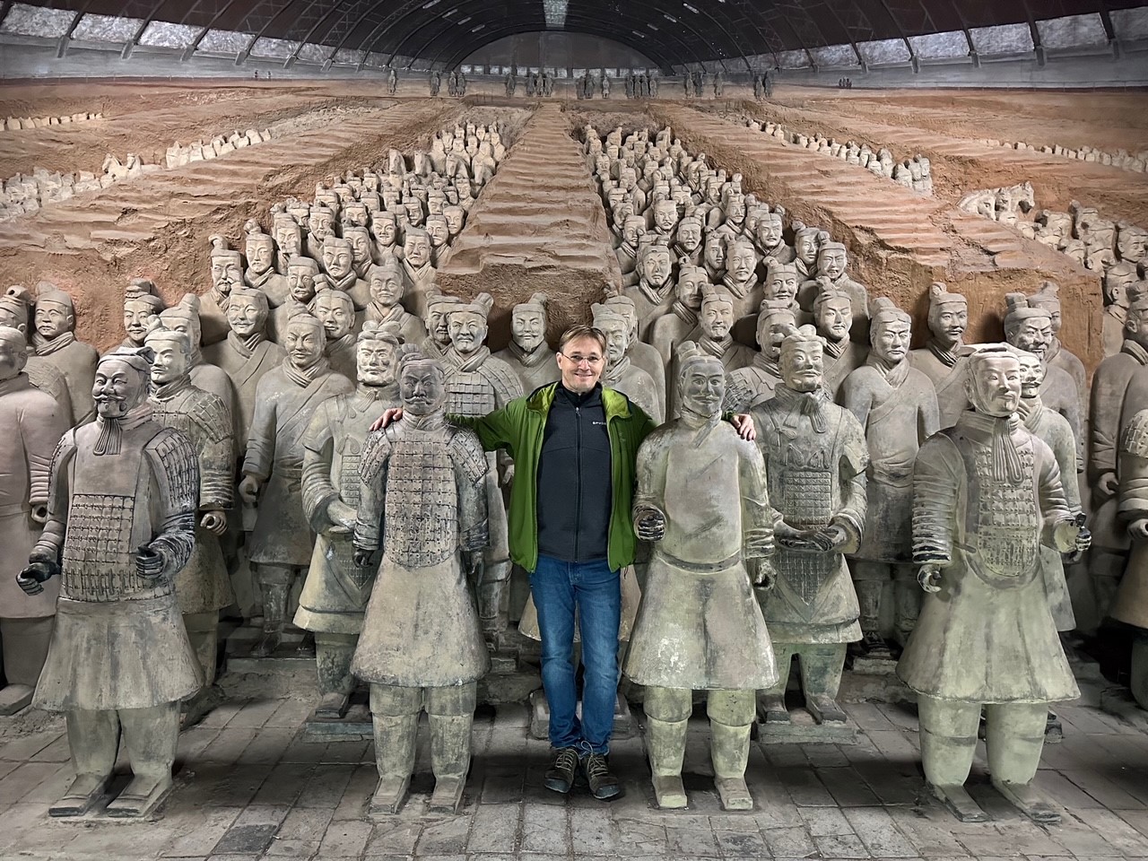 Robert Pal with statues in China