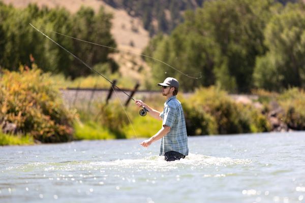 A student casts a fly line