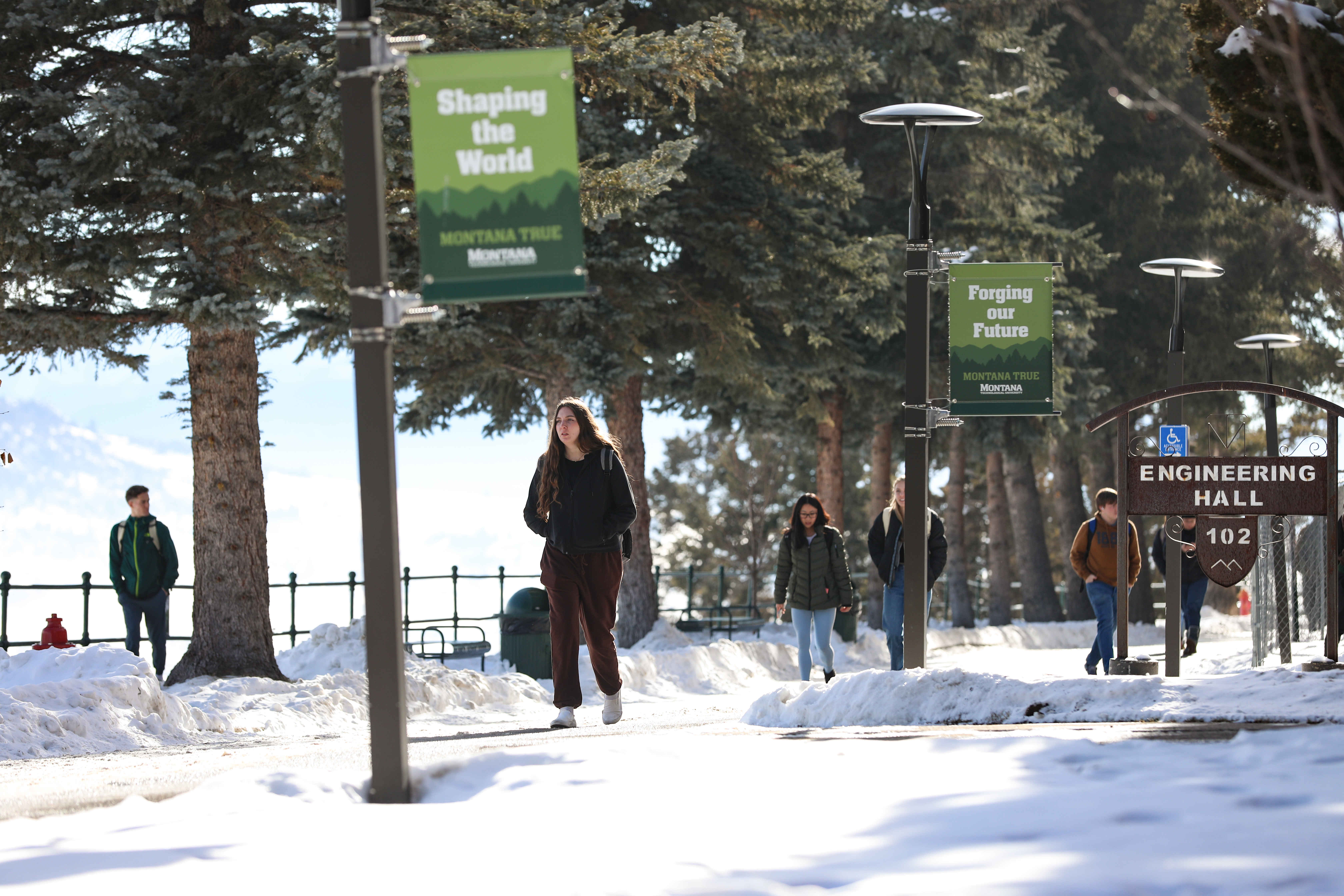 Students walk on Montana Tech's snowy campus