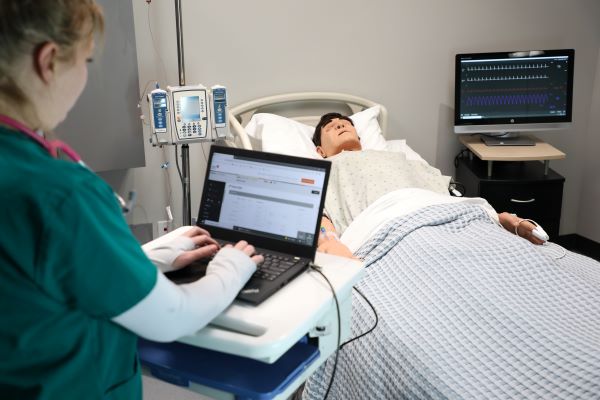 A student works in the Lesar Family Nursing Simulation Center