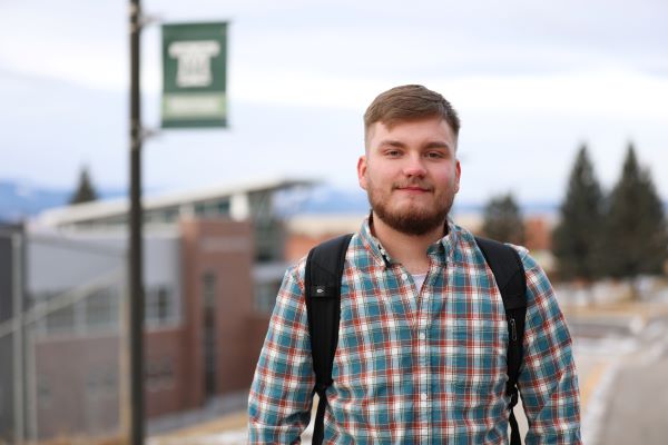 Ethan Heggem headshot taken outside on campus