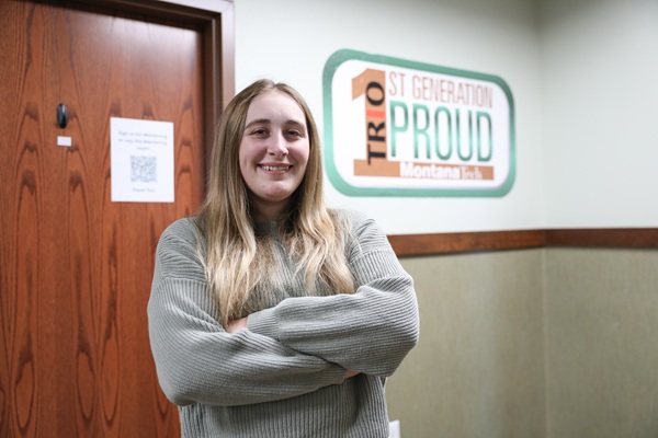 !Taylor in front of TRIO sign