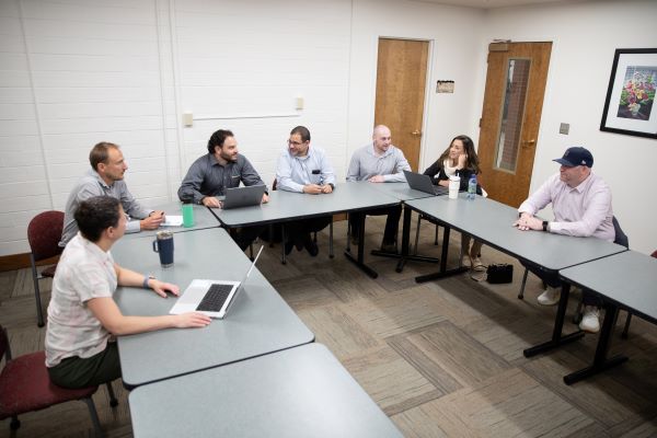Dr. Luis Cubano visits with investigators of the CET 