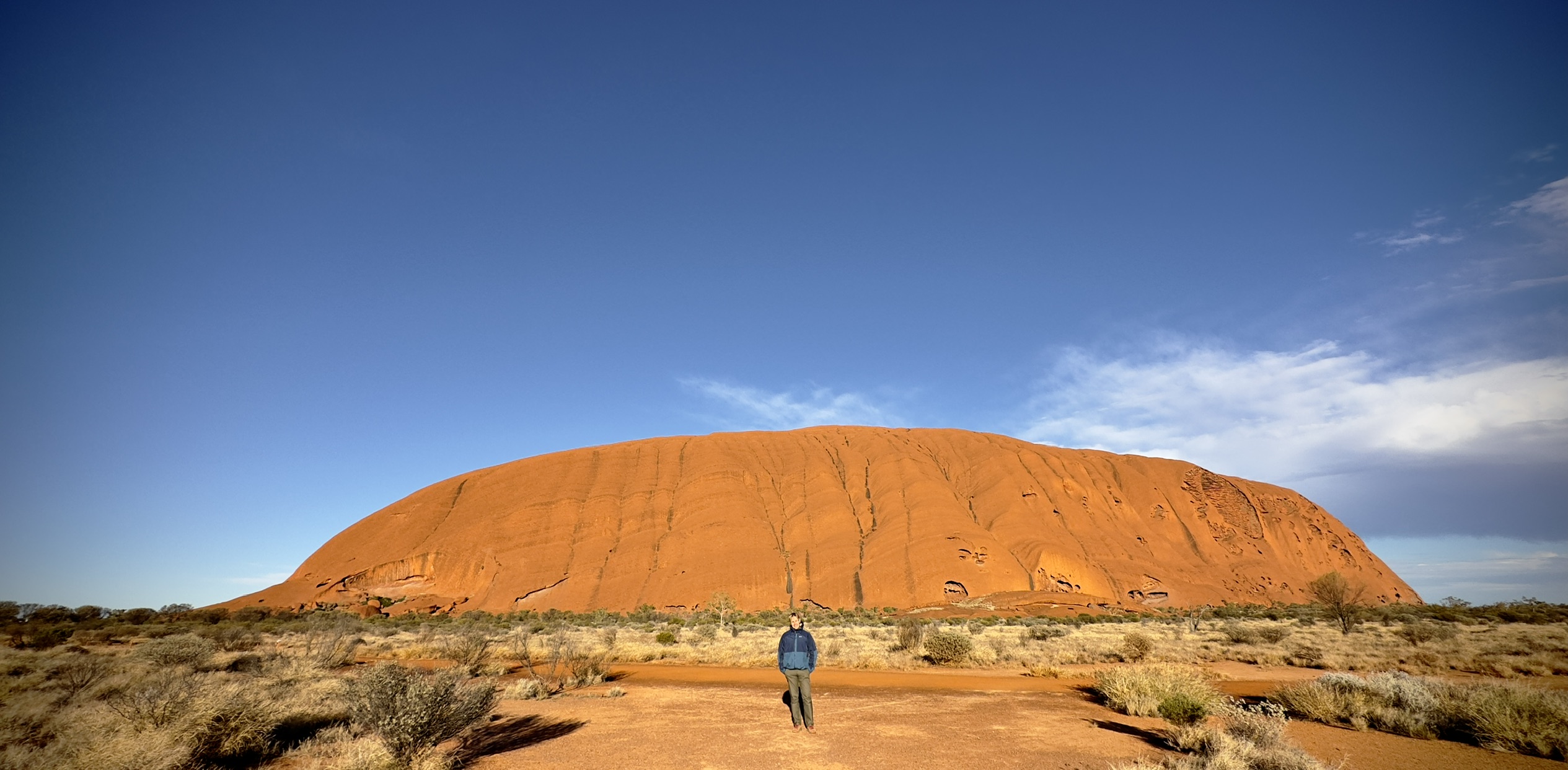 Dr. Robert pal in front of Ayers Rock 