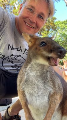 Dr. Robert Pal poses with an animal in Australia