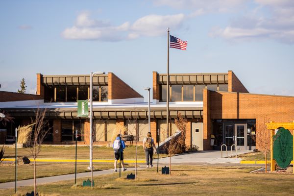 A student walks toward Highlands College