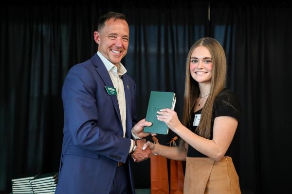 Chancellor Les Cook awards a scholarship at Scholars Day