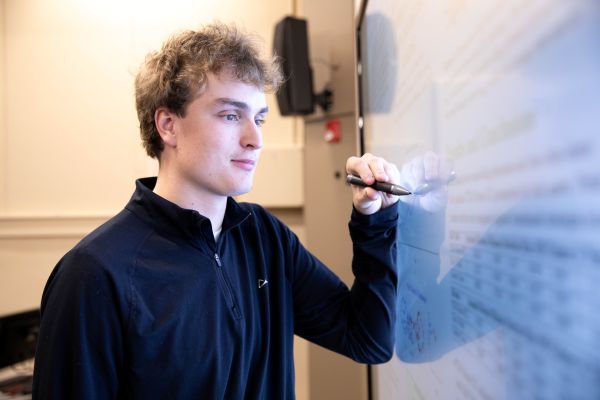 Adam Moser at the whiteboard