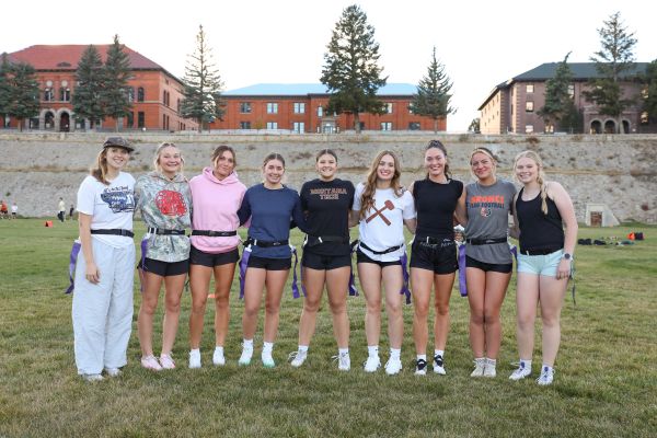 The flag football team poses for a photo