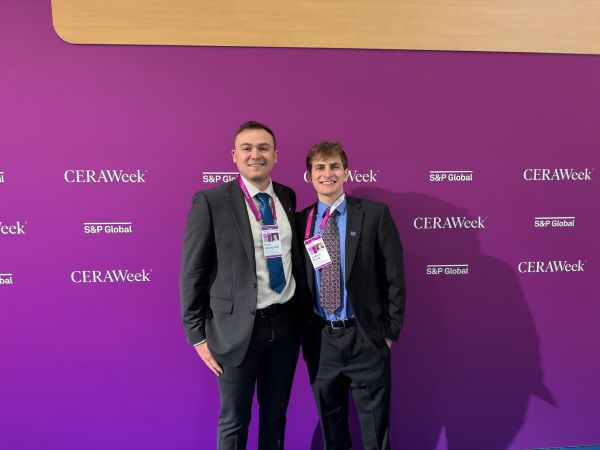 Evan Guengerich and Andrew Woods at CERA Week. 