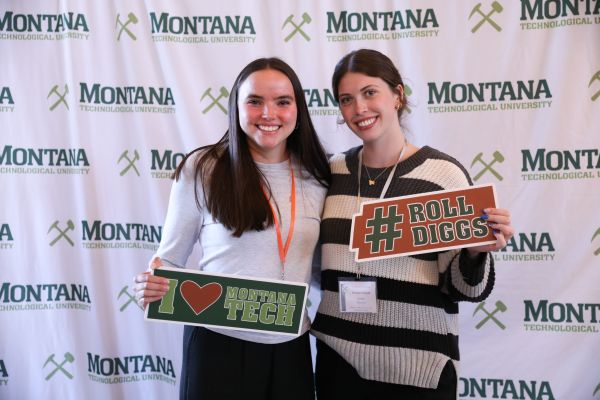 STudents hold Montana Tech pennants