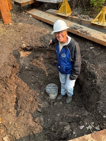 Mary North Abbott with the plugged well. 