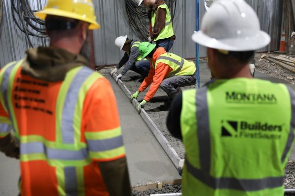 Students work with poured concrete